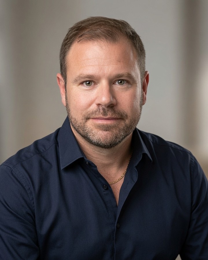 Professional headshot of Gregory Savitch.